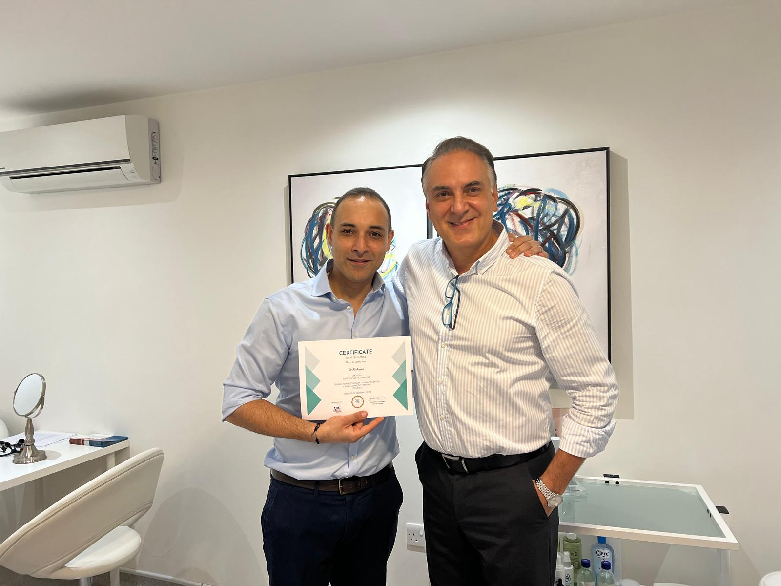 Dr Mehrdad Honarvar presenting a certificate to another delegate